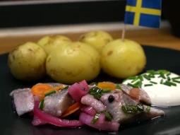 Onion pickled herring with chili